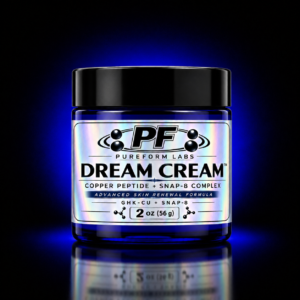 PureForm Labs Dream Cream – GHK-Cu + SNAP-8 Peptide Tallow Cream - PureForm Labs Blue glass jar with a black lid and holographic label reading 'DREAM CREAM' by PureForm Labs, 2 oz (56 g) material shown on dark background.